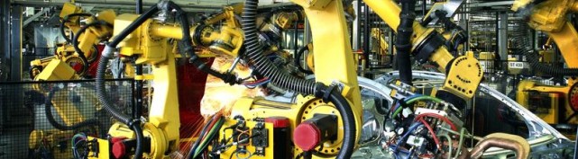 welding robots in a car manufactory